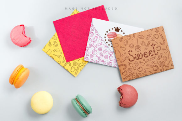 Evaluating the Four Envelopes Mockup with Macarons for Brand Presentation